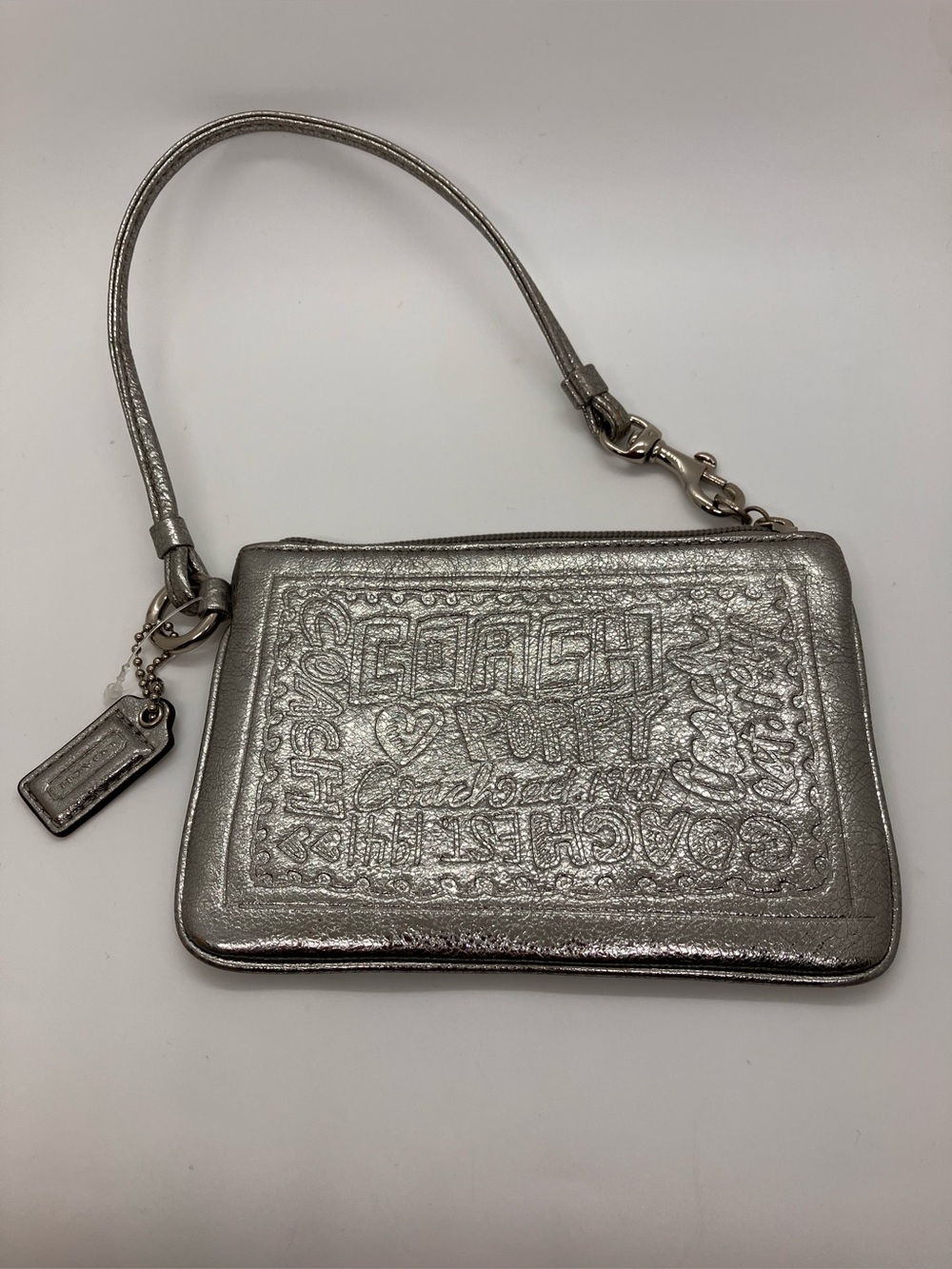 Rare Coach Poppy Metallic Silver Leather Stamp Script Embossed Small Wristlet